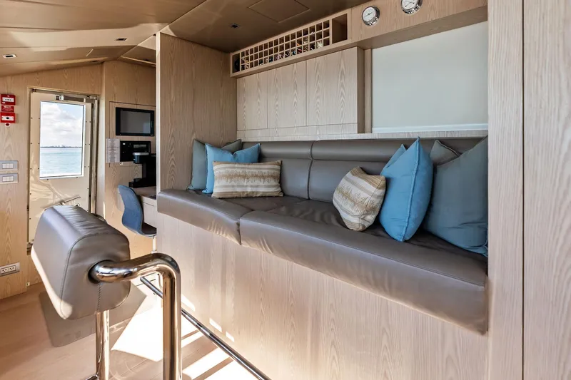 Glory Yacht Photos Pics Luxurious interior of 2023 Sanlorenzo SD126 yacht with plush seating and modern decor.