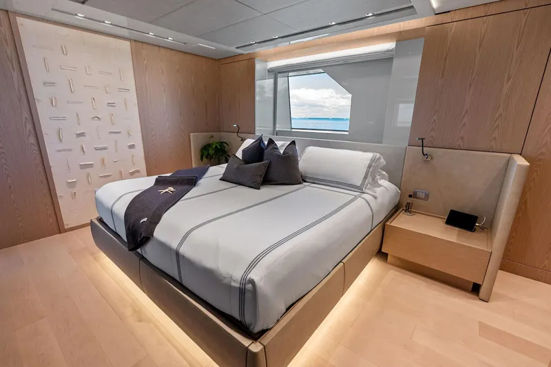 Glory Yacht Photos Pics Luxurious bedroom interior of 2023 Sanlorenzo SD126 yacht with modern design and ocean view.