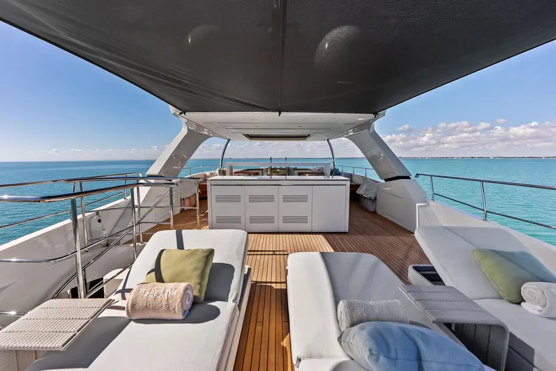 Glory Yacht Photos Pics Luxurious 2023 Sanlorenzo SD126 yacht deck with sun loungers and ocean view.
