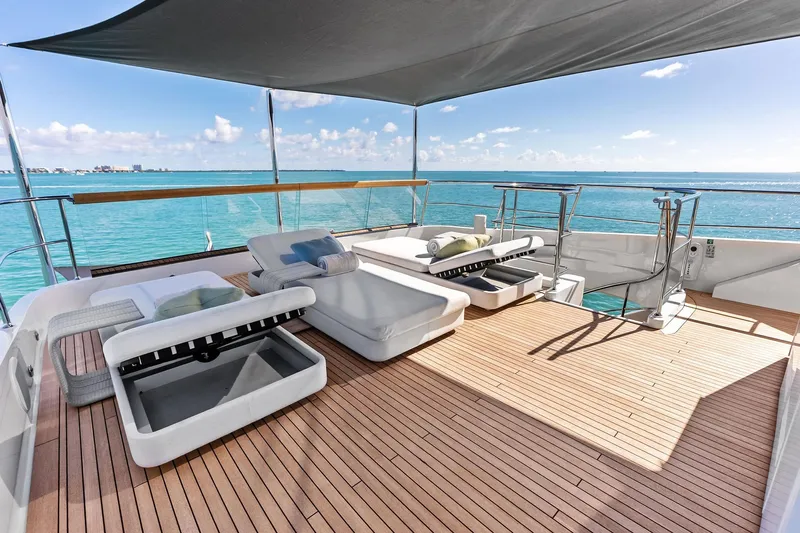 Glory Yacht Photos Pics Luxurious 2023 Sanlorenzo SD126 yacht deck with sun loungers and ocean view.