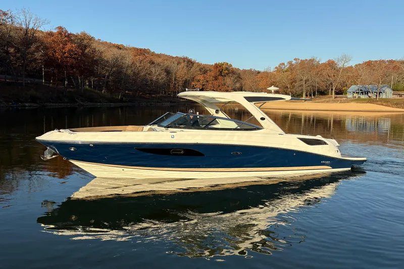  Yacht Photos Pics 2016 Sea Ray 350 SLX boat on calm lake with autumn trees in background.
