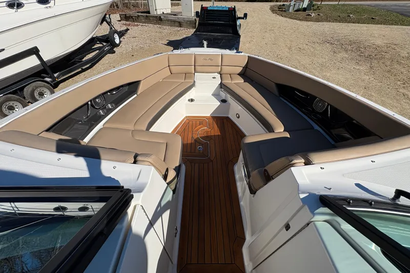  Yacht Photos Pics Luxurious 2016 Sea Ray 350 SLX boat interior with tan seating and wooden flooring.