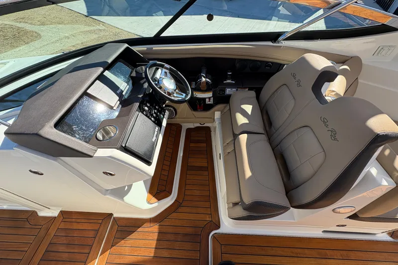  Yacht Photos Pics 2016 Sea Ray 350 SLX cockpit with leather seats and wooden flooring.