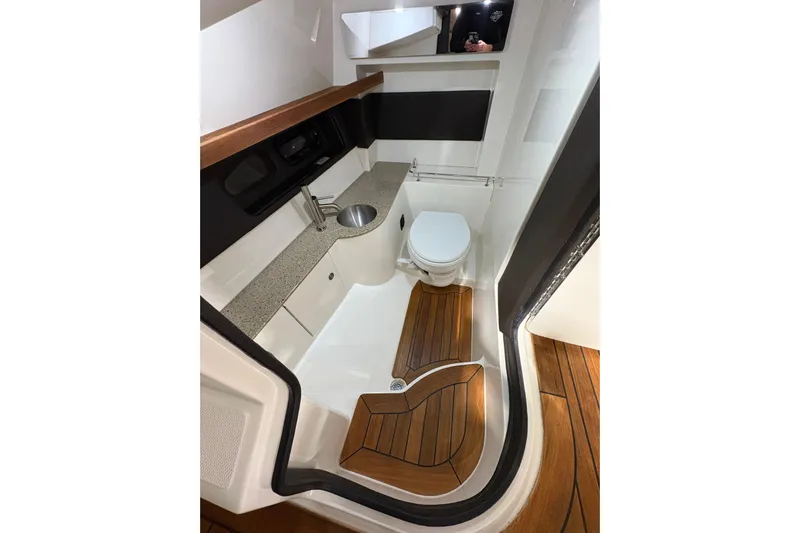  Yacht Photos Pics Luxurious bathroom interior of 2016 Sea Ray 350 SLX boat with modern fixtures.