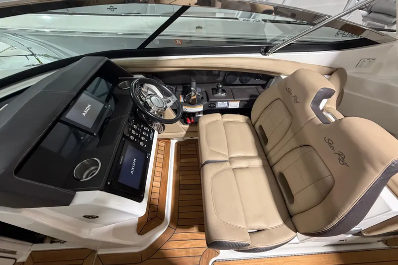  Yacht Photos Pics Interior of 2016 Sea Ray 350 SLX boat with leather seats and modern dashboard.
