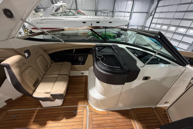  Yacht Photos Pics 2016 Sea Ray 350 SLX boat interior with tan seating and wooden flooring.