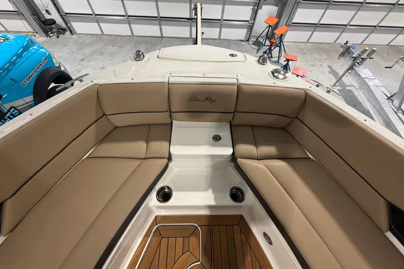  Yacht Photos Pics 2016 Sea Ray 350 SLX boat interior with tan seating and wood flooring.
