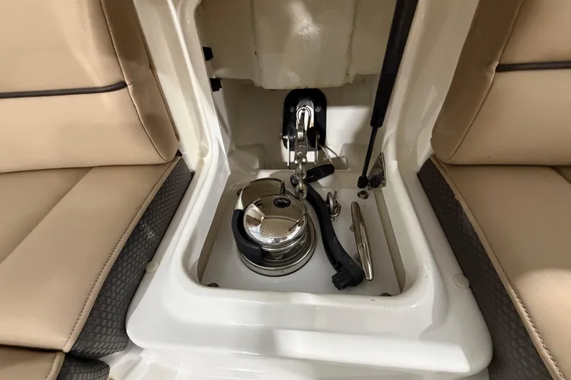  Yacht Photos Pics 2016 Sea Ray 350 SLX boat storage compartment with beige seating and mechanical components.