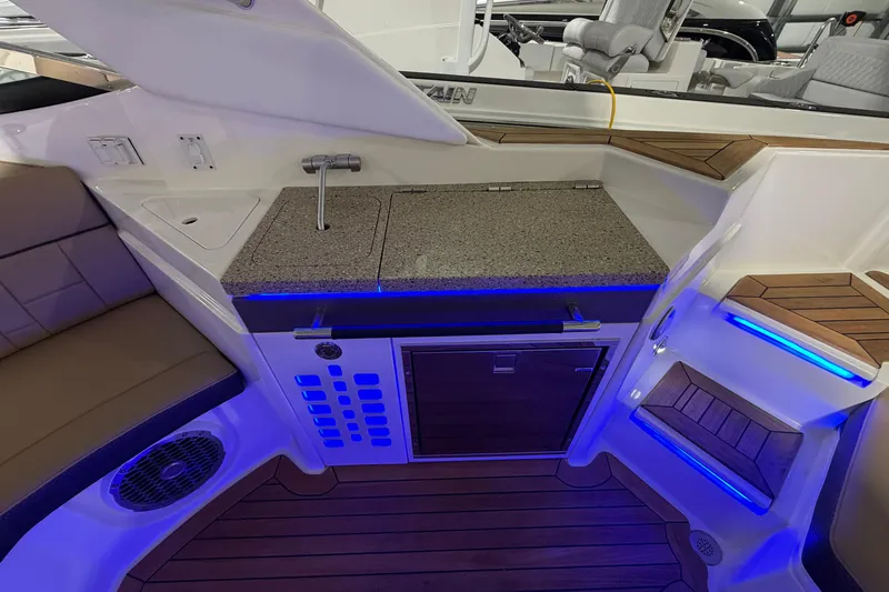  Yacht Photos Pics 2016 Sea Ray 350 SLX boat interior with kitchenette, seating, and blue LED lighting.