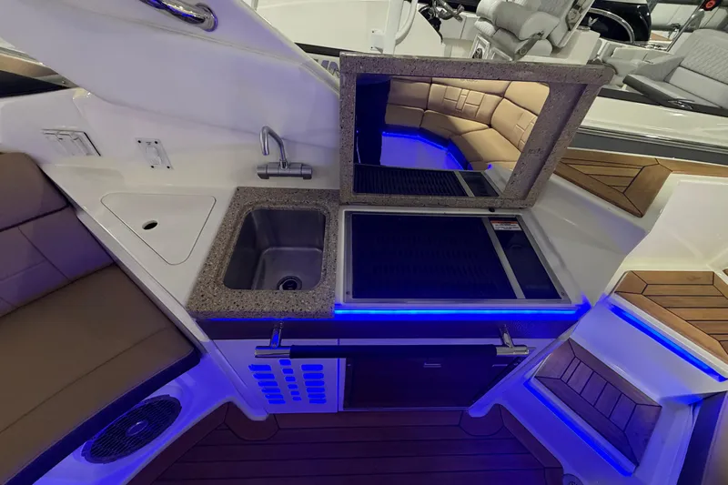  Yacht Photos Pics Luxurious 2016 Sea Ray 350 SLX boat interior with kitchenette and seating area.