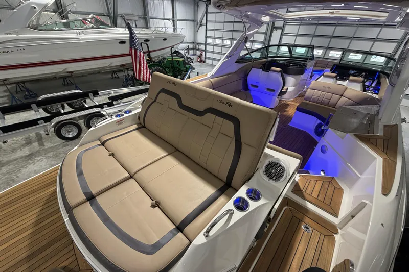  Yacht Photos Pics 2016 Sea Ray 350 SLX luxury boat interior with tan seating and blue lighting.