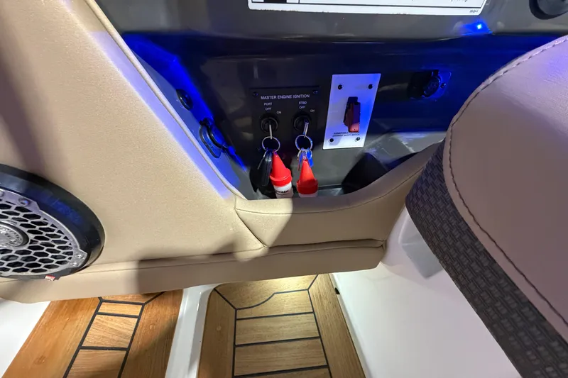  Yacht Photos Pics Control panel of a 2016 Sea Ray 350 SLX boat with ignition keys and switches.