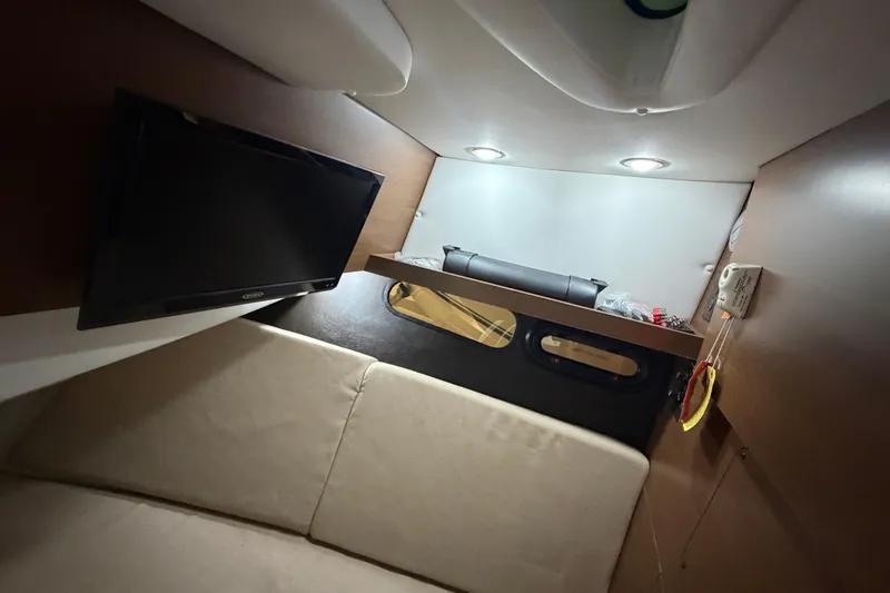  Yacht Photos Pics Interior cabin of 2016 Sea Ray 350 SLX with TV and seating area.