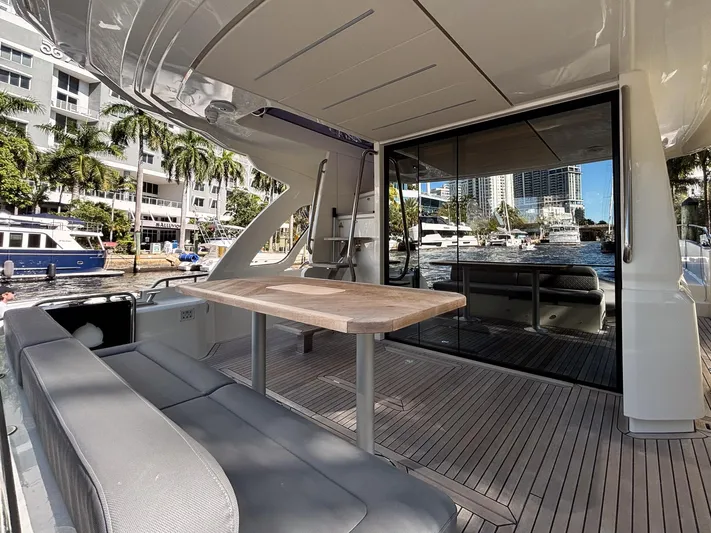 Micky's Dream Yacht Photos Pics 2020 Greenline 45 Fly yacht with outdoor seating and waterfront view.