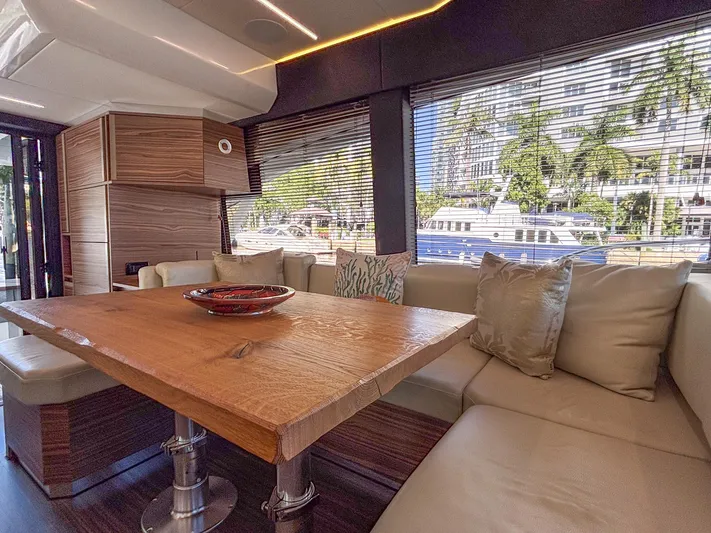 Micky's Dream Yacht Photos Pics Luxurious interior of 2020 Greenline 45 Fly yacht with wooden table and plush seating.