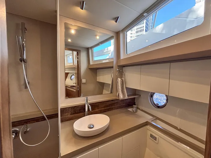 Micky's Dream Yacht Photos Pics Luxurious bathroom interior of 2020 Greenline 45 Fly yacht with modern fixtures and ample lighting.