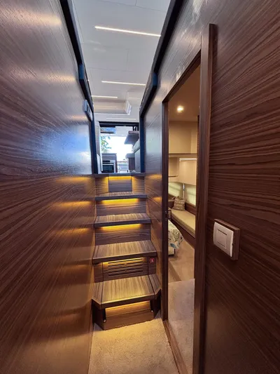 Micky's Dream Yacht Photos Pics Interior of 2020 Greenline 45 Fly yacht with wooden stairs and modern lighting.