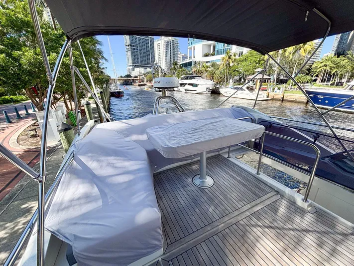 Micky's Dream Yacht Photos Pics Flybridge of 2020 Greenline 45 Fly yacht docked by a scenic waterfront.