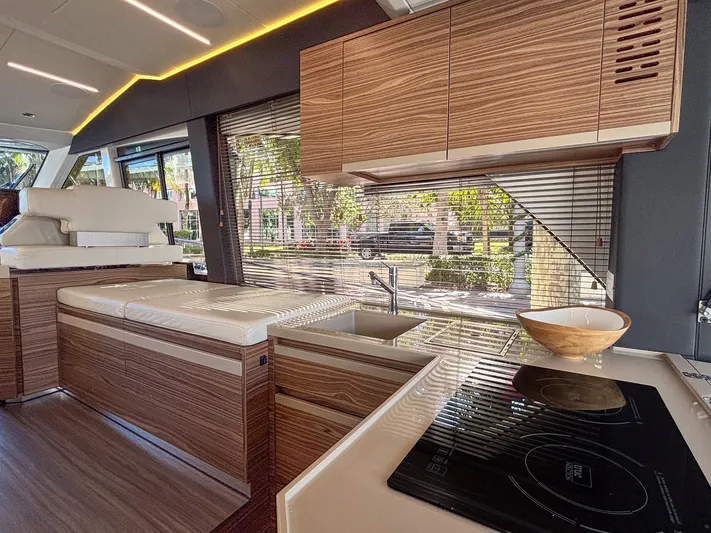 Micky's Dream Yacht Photos Pics Luxurious interior of 2020 Greenline 45 Fly yacht with modern kitchen and seating area.