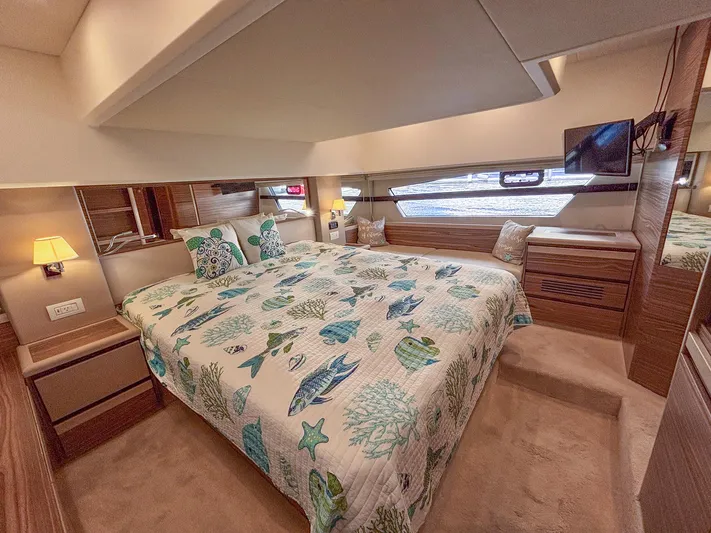 Micky's Dream Yacht Photos Pics Luxurious bedroom interior of 2020 Greenline 45 Fly yacht with nautical-themed bedding.
