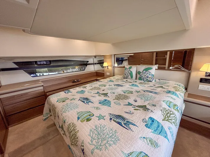 Micky's Dream Yacht Photos Pics Luxurious bedroom interior of 2020 Greenline 45 Fly yacht with ocean-themed bedding.