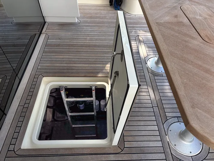Micky's Dream Yacht Photos Pics Open hatch on 2020 Greenline 45 Fly yacht deck, revealing interior access ladder.