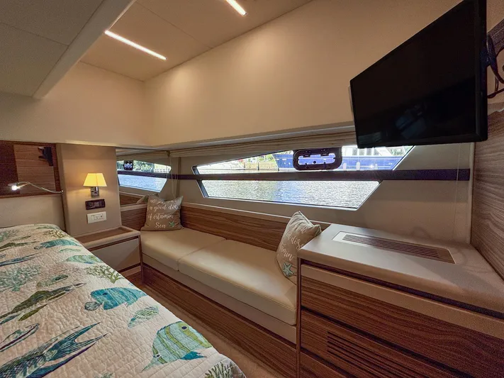 Micky's Dream Yacht Photos Pics Luxurious interior of 2020 Greenline 45 Fly yacht with cozy seating and scenic window view.