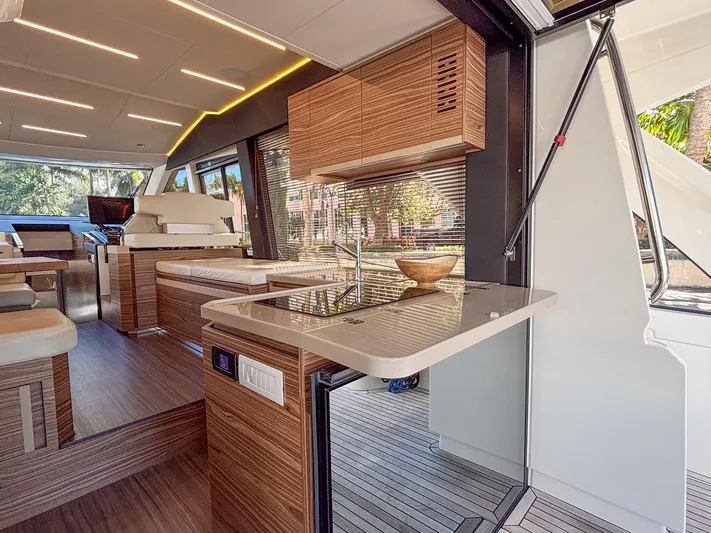 Micky's Dream Yacht Photos Pics Luxurious interior of 2020 Greenline 45 Fly yacht with modern kitchen and seating area.