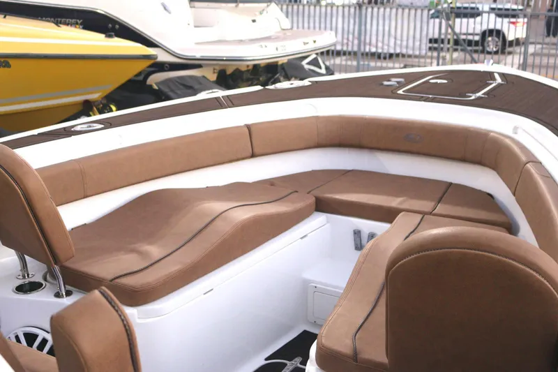  Yacht Photos Pics 2022 Sea Hunt Ultra 305 SE boat interior with brown seating and white accents.