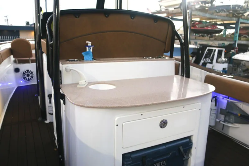  Yacht Photos Pics 2022 Sea Hunt Ultra 305 SE boat interior with countertop and seating area.