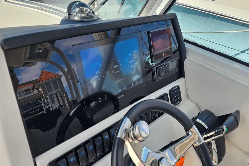  Yacht Photos Pics 2023 Sailfish 276 DC boat dashboard with modern navigation and control systems.