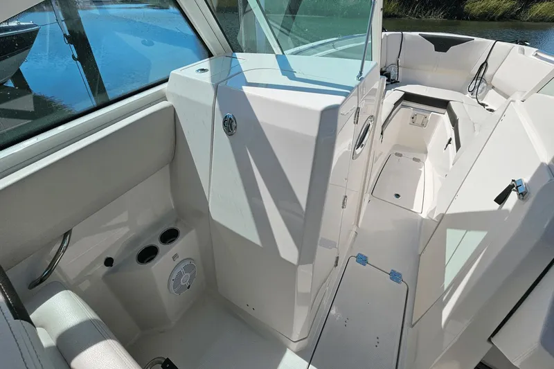  Yacht Photos Pics 2023 Sailfish 276 DC boat interior with seating, cup holders, and storage compartments.