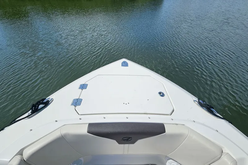  Yacht Photos Pics Bow view of 2023 Sailfish 276 DC boat on calm water.