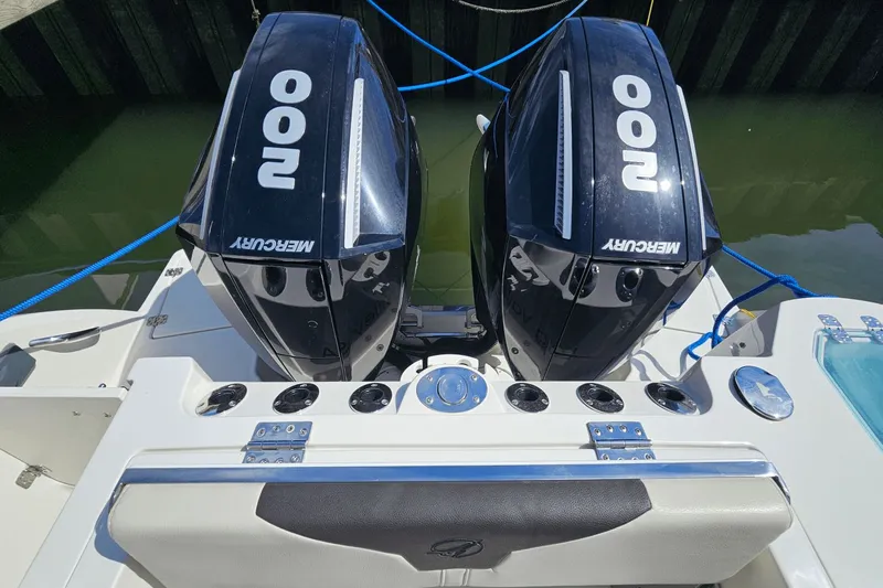  Yacht Photos Pics 2023 Sailfish 276 DC boat with dual Mercury 200 engines docked.
