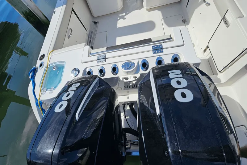  Yacht Photos Pics 2023 Sailfish 276 DC boat with dual 200 horsepower engines, docked.