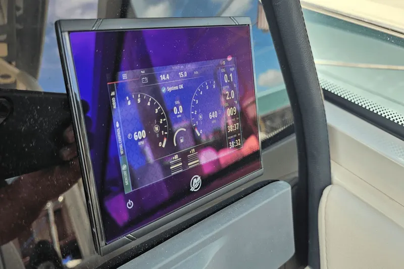  Yacht Photos Pics Digital display on 2023 Sailfish 276 DC boat dashboard showing navigation data.