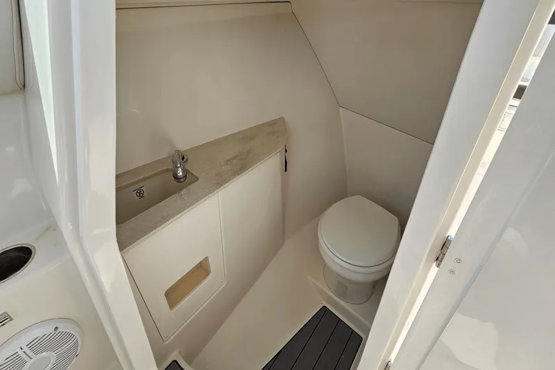  Yacht Photos Pics 2023 Sailfish 276 DC boat interior bathroom with sink and toilet.
