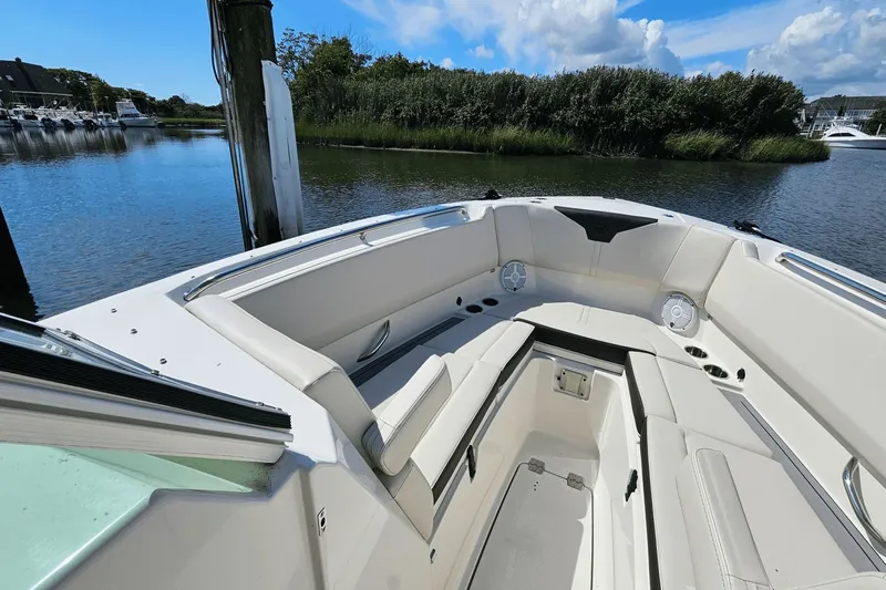  Yacht Photos Pics 2023 Sailfish 276 DC boat interior with comfortable seating and scenic water view.