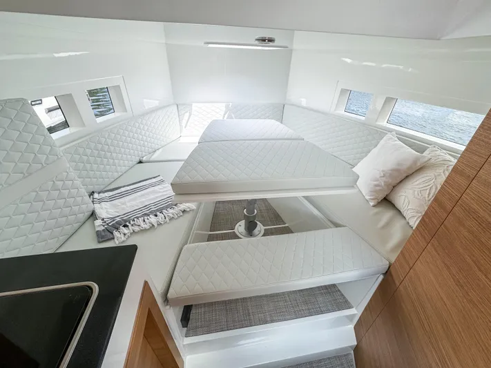  Yacht Photos Pics 2024 De Antonio Yachts D28 Cruiser interior with modern seating and elegant design.