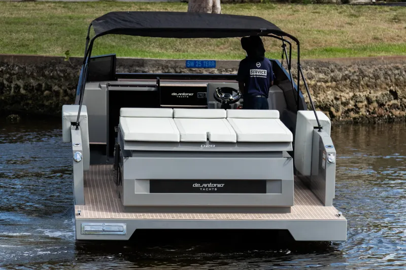  Yacht Photos Pics 2024 De Antonio Yachts D28 Cruiser on water, rear view with canopy and seating.