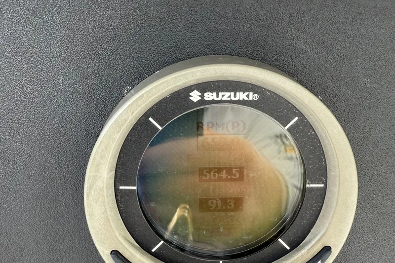  Yacht Photos Pics Suzuki gauge displaying RPM and speed on a 2007 Jupiter 31 boat.