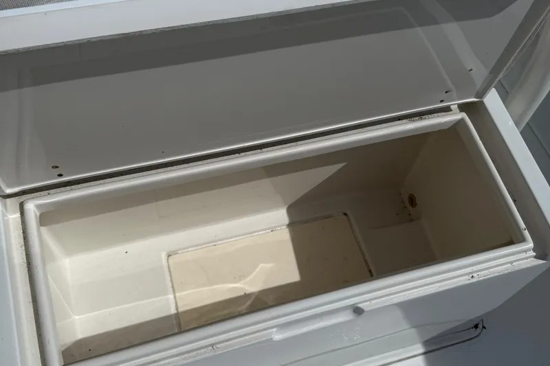  Yacht Photos Pics Open storage compartment on a 2007 Jupiter 31 boat, showing interior space.