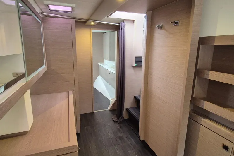  Yacht Photos Pics Interior of 2021 Fountaine Pajot Saona 47 catamaran, featuring modern wood finishes and sleek design.