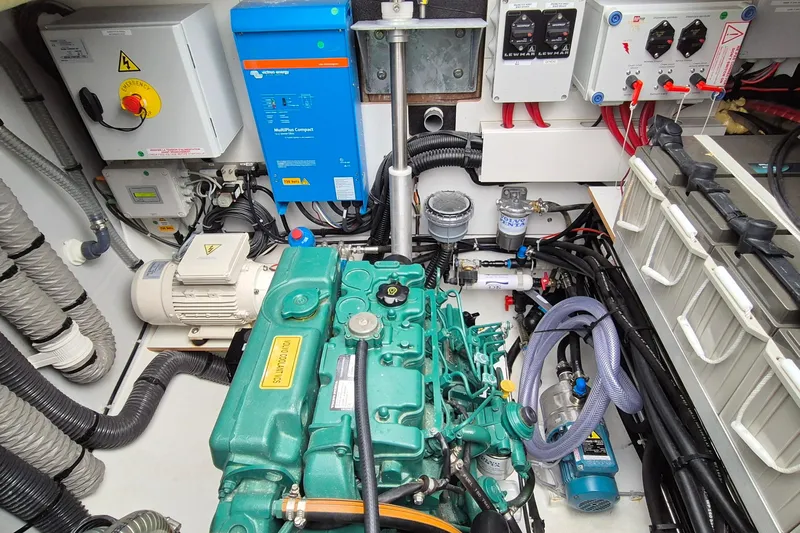  Yacht Photos Pics Engine room of 2021 Fountaine Pajot Saona 47 catamaran with visible machinery and wiring.