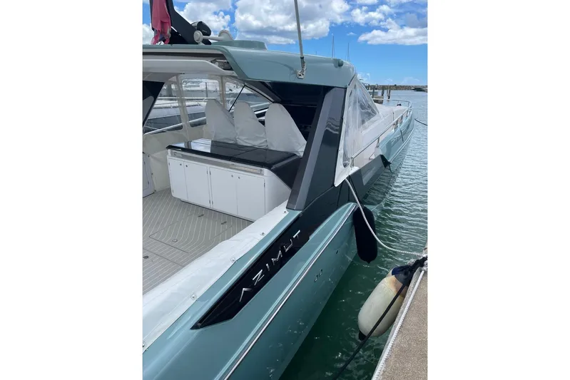  Yacht Photos Pics Azimut Verve 48 yacht, 2025 model, docked at marina with clear skies.