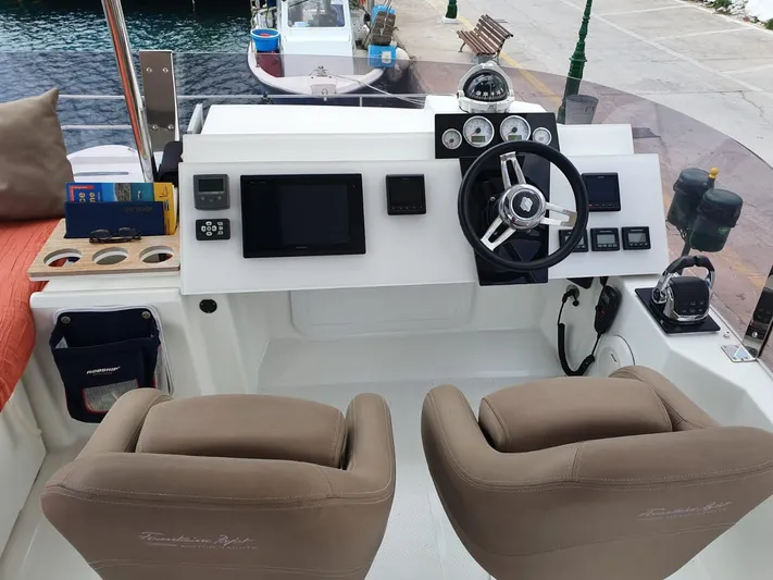  Yacht Photos Pics Helm of 2016 Fountaine Pajot MY 37 with dual seats and navigation equipment.