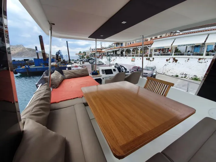  Yacht Photos Pics Fountaine Pajot MY 37 yacht interior with dining area, 2016 model, docked at marina.