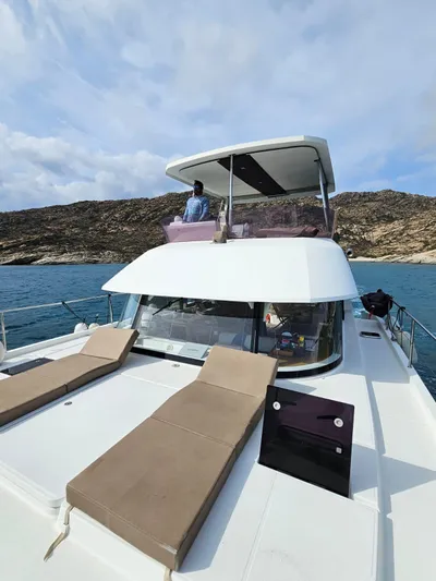  Yacht Photos Pics 2016 Fountaine Pajot MY 37 yacht on water, featuring sun loungers and flybridge.
