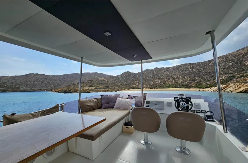  Yacht Photos Pics 2016 Fountaine Pajot MY 37 yacht interior with seating, table, and scenic ocean view.