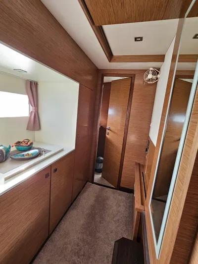  Yacht Photos Pics Interior of 2016 Fountaine Pajot MY 37 yacht with wood finish and modern design.